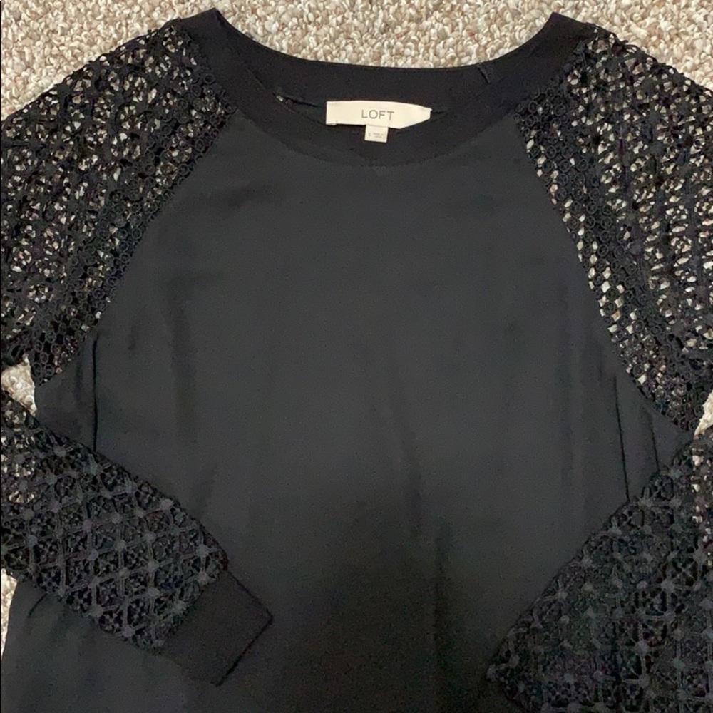 Black loft top with sheer sleeve detailing